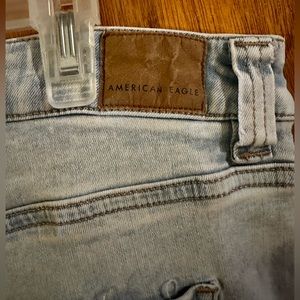 American Eagle flare light colored jeans size 16 distressed look.
